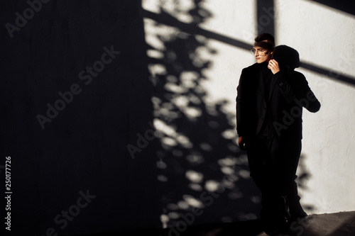 Attractive young man in black suit