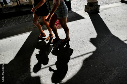 Padua, Italy Pedestrians on the street and shadows.