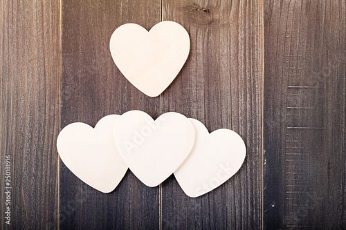 Beautiful paper hearts on wood background