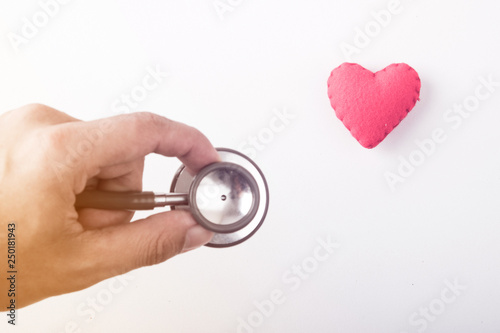 Stethoscope with red heart on a white background