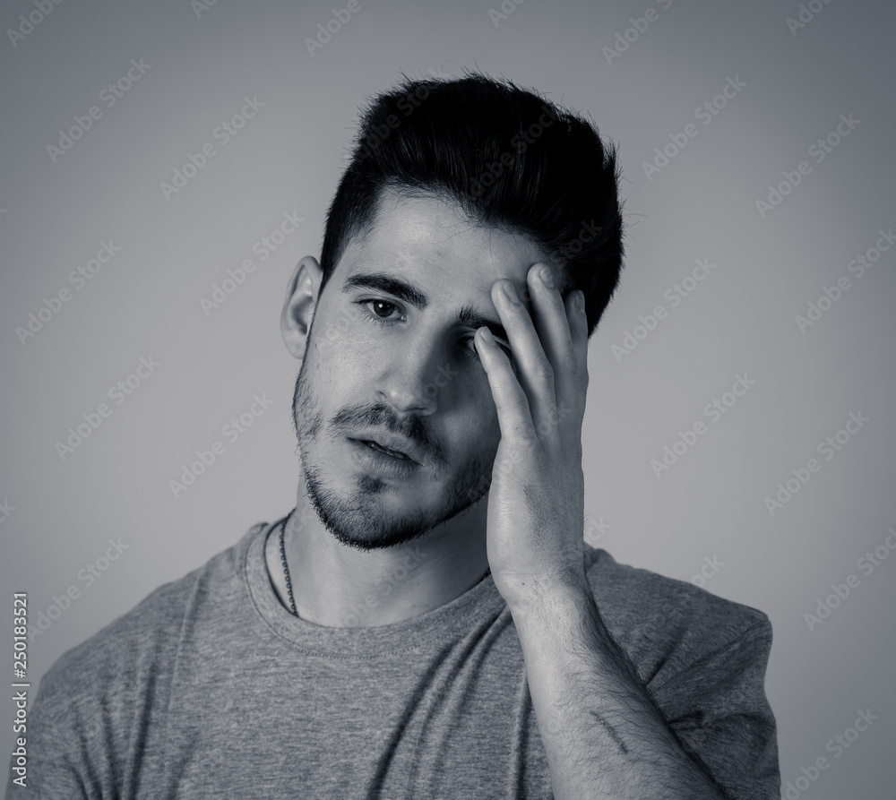 Human expressions, emotions. Young attractive man with sad face