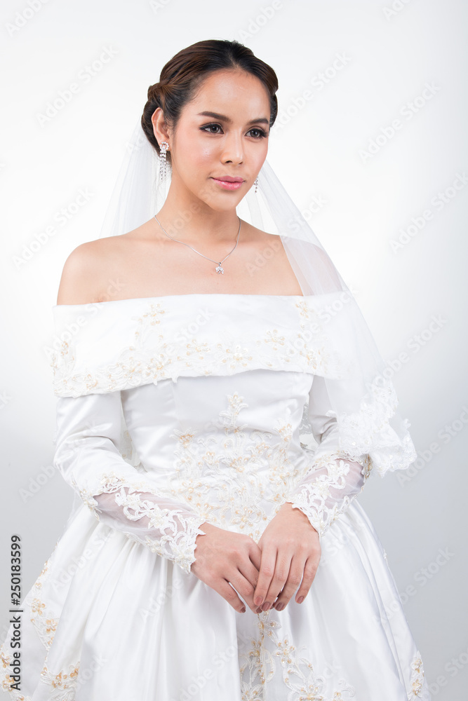 Lovely Asian Beautiful Woman bride in white wedding gown dress with lace veil, black hair, studio lighting white grey gradient background isolated copy space, sweet romantic soft alone bridal concept Lovely Asian Beautiful Woman bride in white wedding gown dress with lace veil, black hair, studio lighting white grey gradient background isolated copy space, sweet romantic soft alone bridal concept