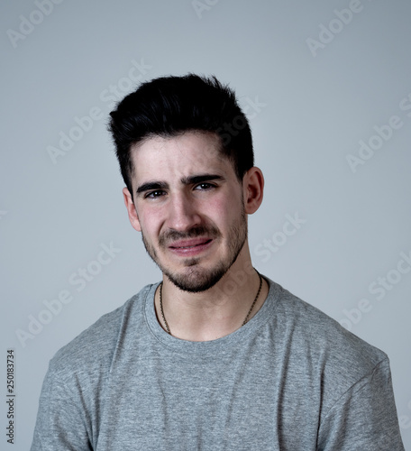 Human expressions and emotions. Portrait of young attractive sad and depressed man