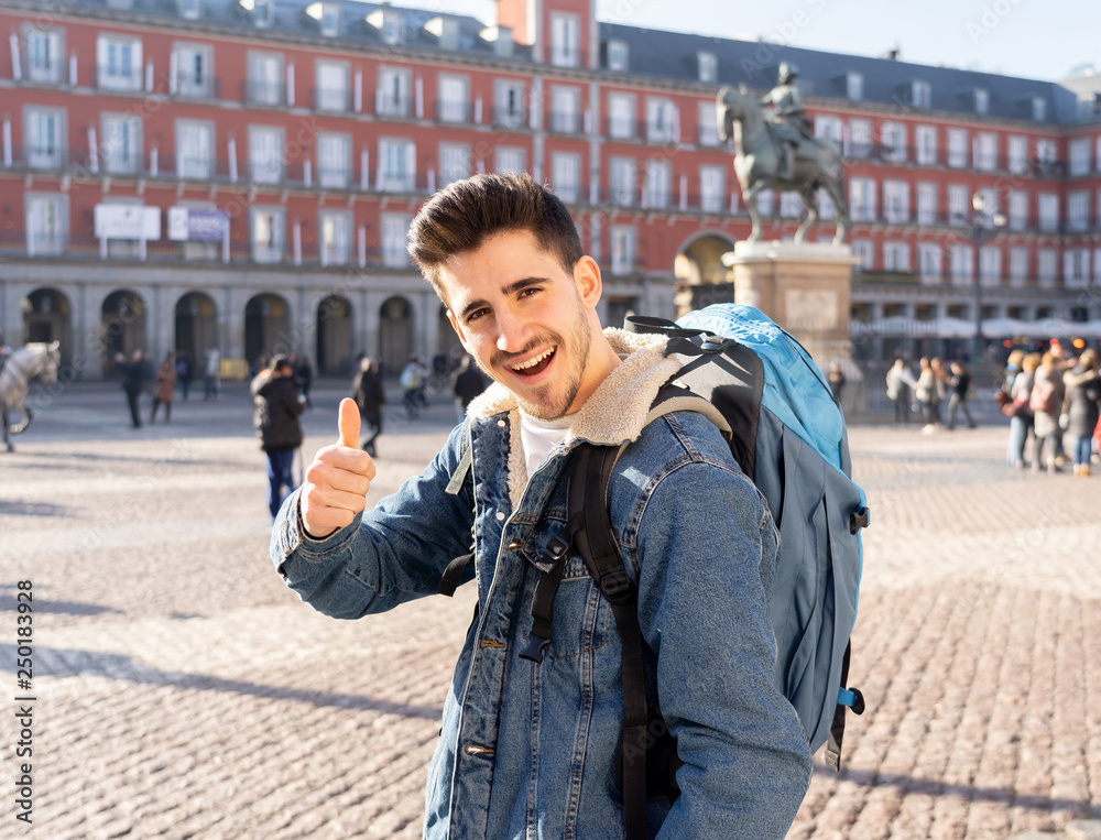 Handsome young caucasian tourist man happy and excited traveling around europe