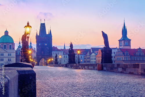 Prague, Czech Republic. Charles Bridge at sunrise, Old Town Bridge Tower in the background