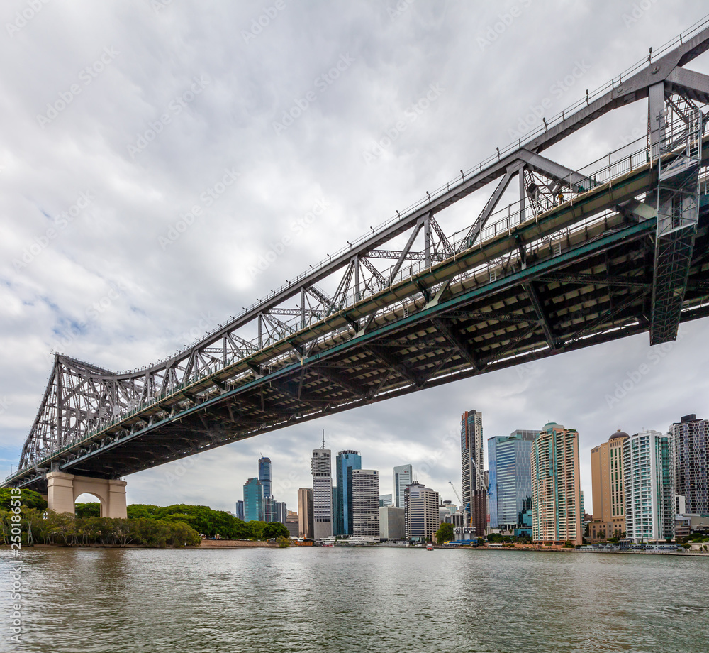 Story Bridge - historic cantilever bridge over Brisbane River and skyscrapers in the background
