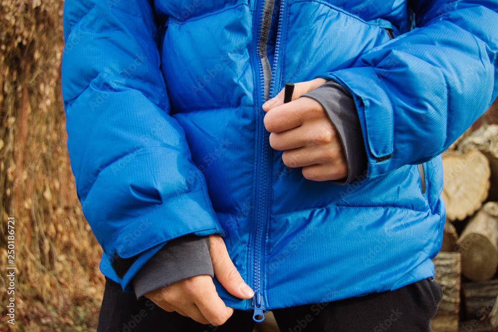 Male model in winter blue jacket posing