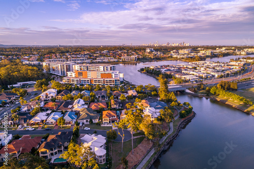 Varsity Lakes suburb luxury real estate at sunset. Gold Coast, Queensland, Australia - aerial landscape