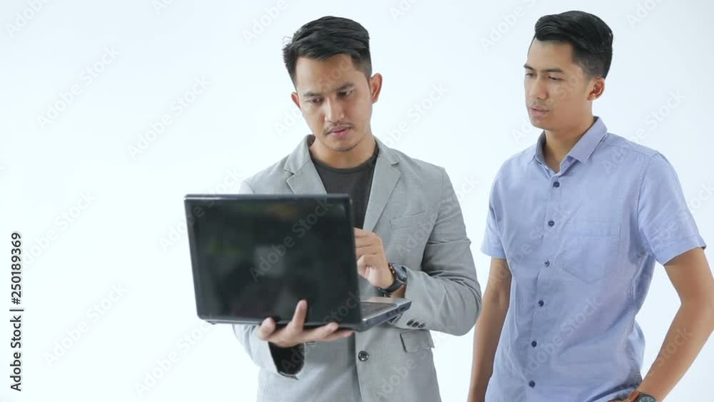 Two young business man discuss about their business by modern technology Two young business man discuss about their business by modern technology