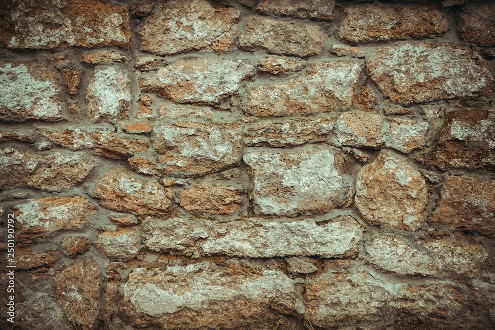 old wall of stone shell rock of arbitrary shape. toned image. background for titles old wall of stone shell rock of arbitrary shape. toned image. background for titles