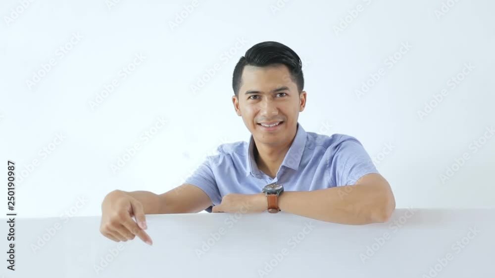 Pose of young business man holding and pointing a free space Pose of young business man holding and pointing a free space