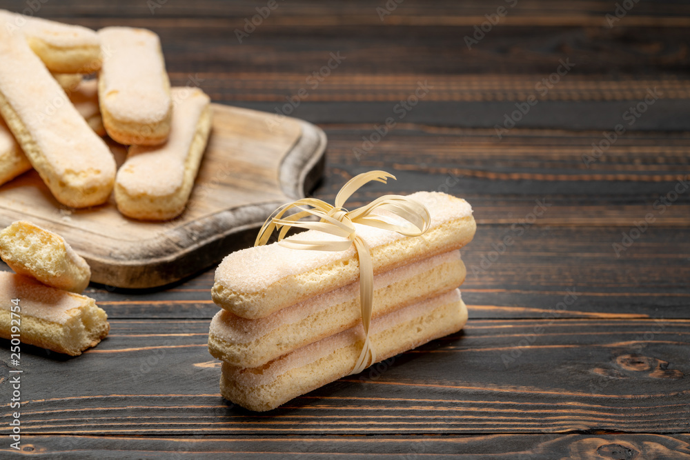 Fototapeta premium Italian Savoiardi ladyfingers Biscuits on wooden backgound with copy space