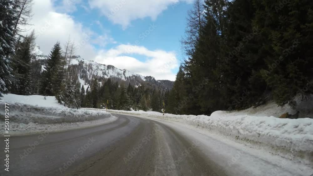 driving car in winter on countryside mountain alps curvy ice covered road italian alps driving car in winter on countryside mountain alps curvy ice covered road italian alps