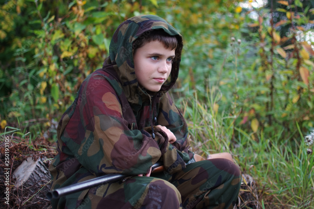 portrait of a young man with a hunting rifle