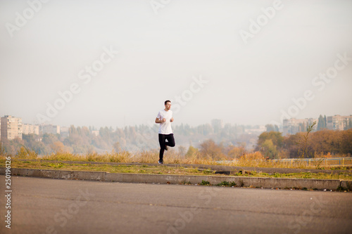 Man run at autumn morning. Healthy lifestyle © Svetlana