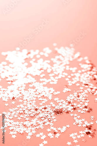 Cream colored background with shimmering small stars.