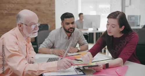 Multicultural business team brainstorming in modern office photo