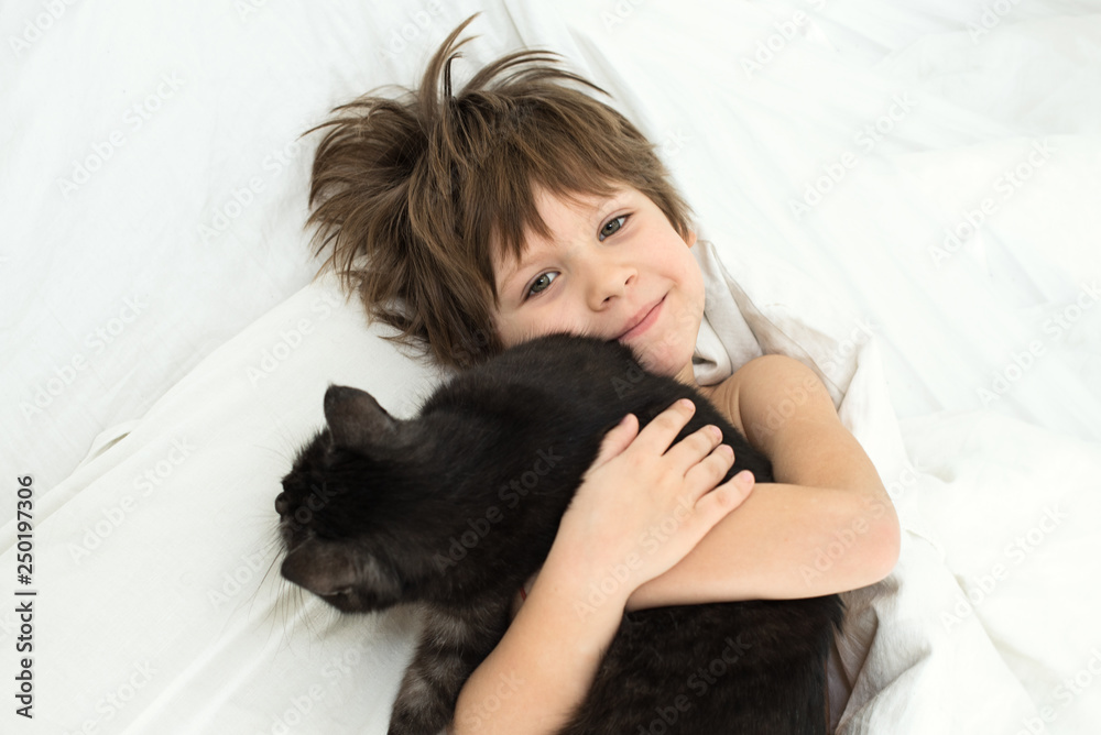 boy with a cat. A child of 6 years without a tooth. boy with a cat. A child of 6 years without a tooth.