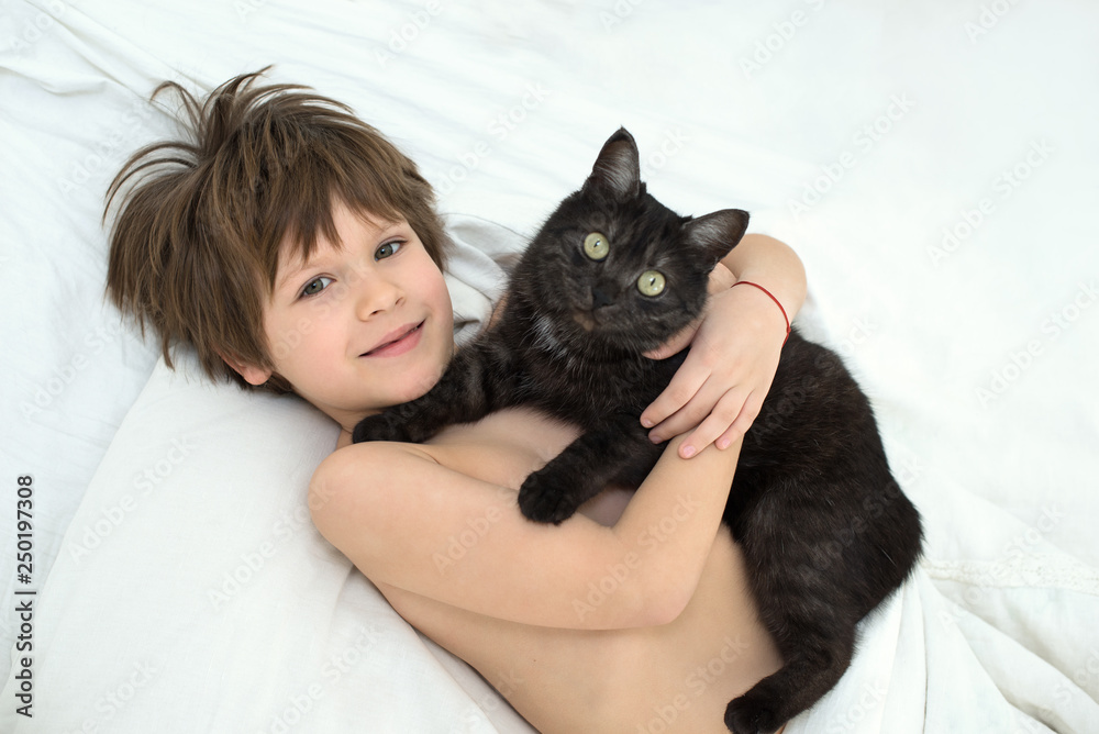 boy with a cat. A child of 6 years without a tooth. boy with a cat. A child of 6 years without a tooth.