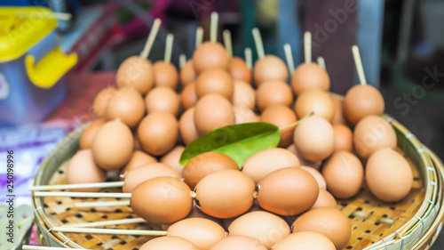 Closeup of Asian grilled eggs in the street food local market.