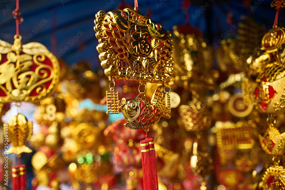 Colorful traditional asian decorations hanging in street store