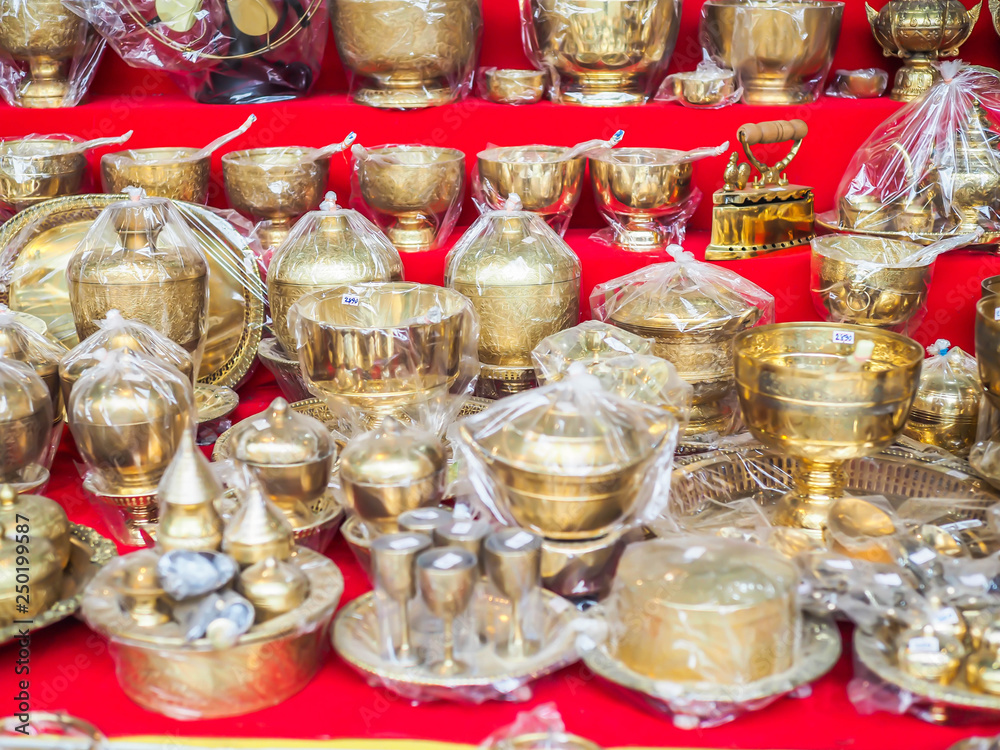 Group of Asian brass monk supply in the market or shop.