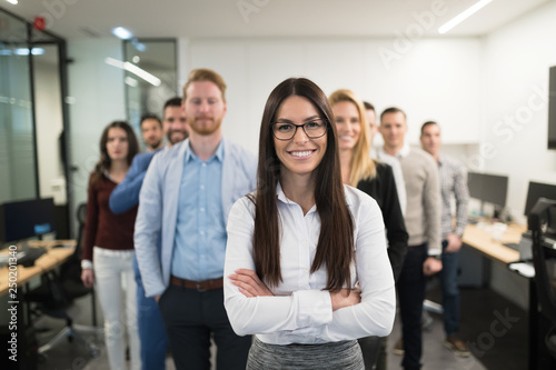 Portrait of business team posing in office photo