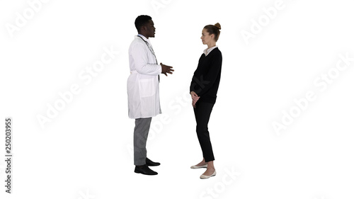 Male african doctor talking to female patient on white background.