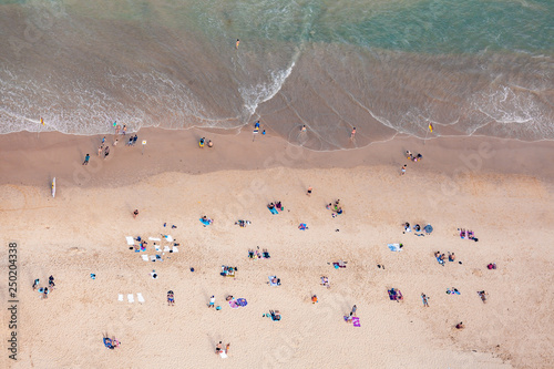 Looking down on people on the beach - aerial view