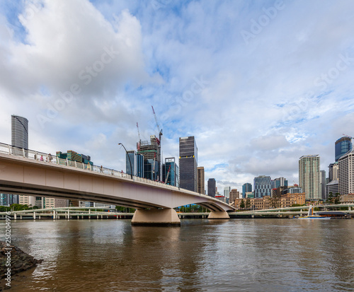 Bridge across Brisbane river and high-rise buildings on bright summer day © Greg Brave