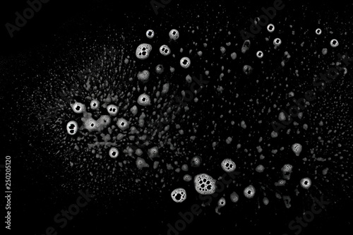 Soap foam  lather isolated on black  with clipping path  texture and background  top view