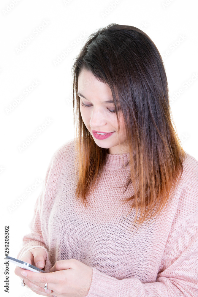 Millennial girl messaging on cell phone on white background Millennial girl messaging on cell phone on white background