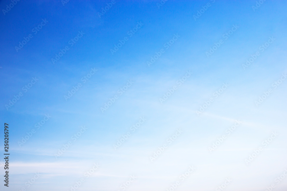 Fluffy blue sky background and white clouds soft focus, and copy space
