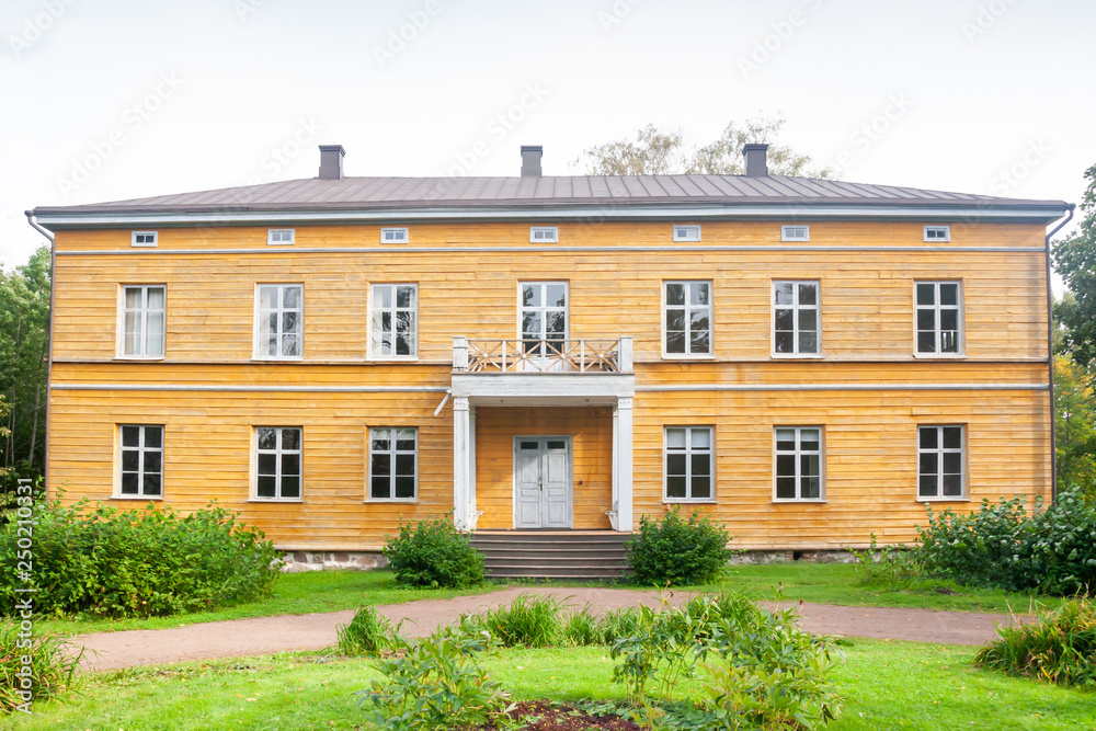 Fototapeta premium KOUVOLA, FINLAND - SEPTEMBER 20, 2018: Beautiful yellow old building of abandoned Anjala manor. The building was built at the turn of the 19th century and belonged to the Wrede family from 1837