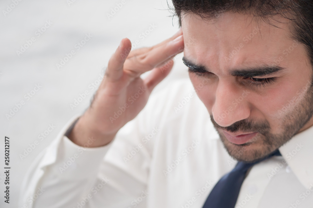 depressed asian business man; portrait of sick indian asian man with depression suffering from headache, vertigo, hangover, migraine, stress depressed asian business man; portrait of sick indian asian man with depression suffering from headache, vertigo, hangover, migraine, stress