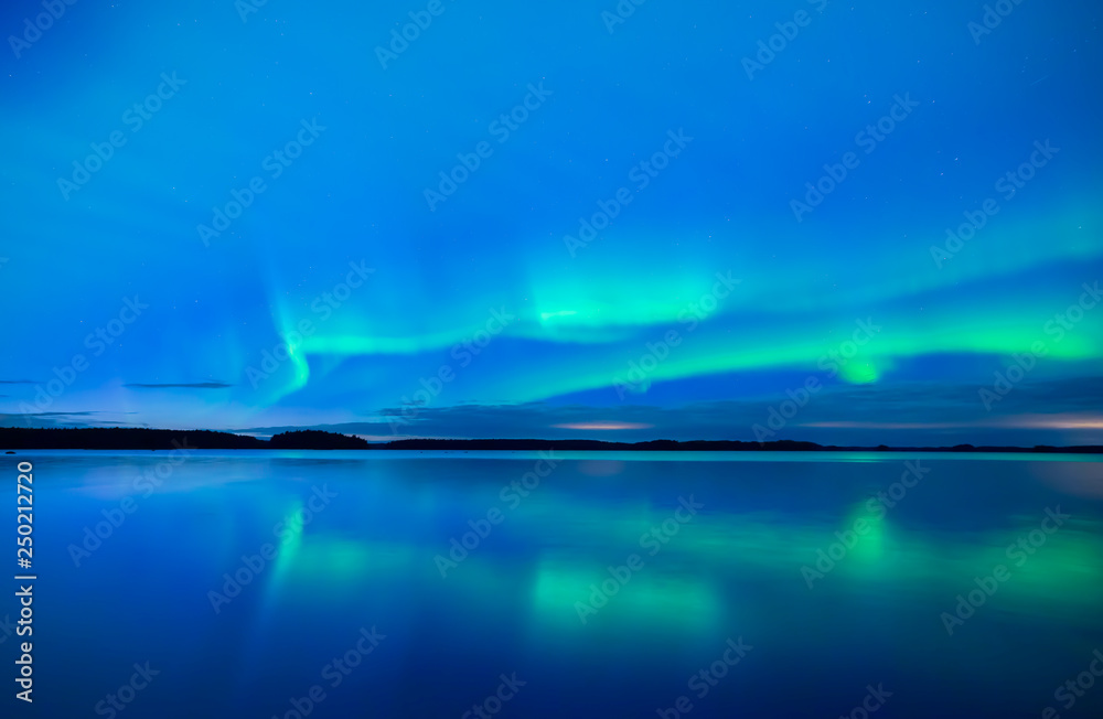 Northern lights background in Farnebofjarden national park in Sweden.
