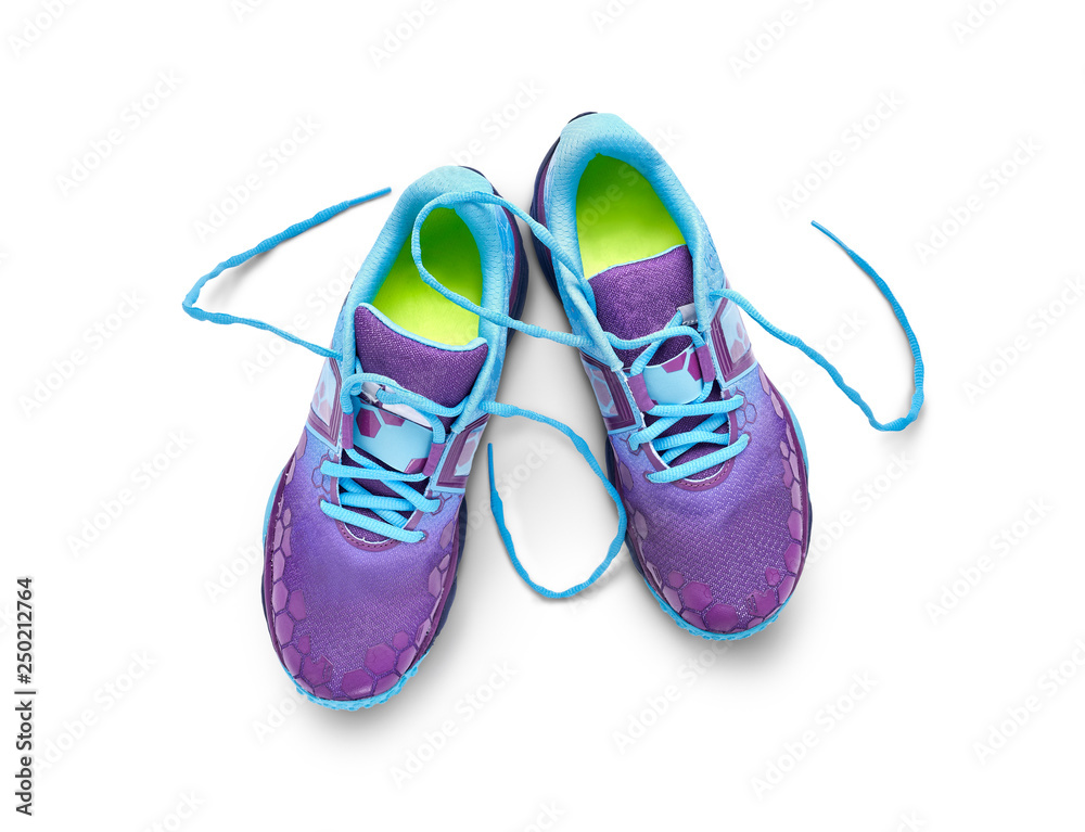 Fototapeta Top view of blue and purple trainers isolated on a white background.