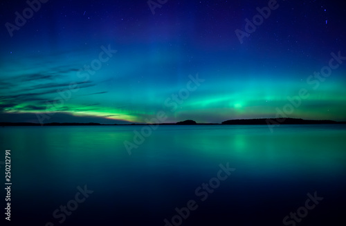 Northern lights background in Farnebofjarden national park in Sweden. © Conny Sjostrom