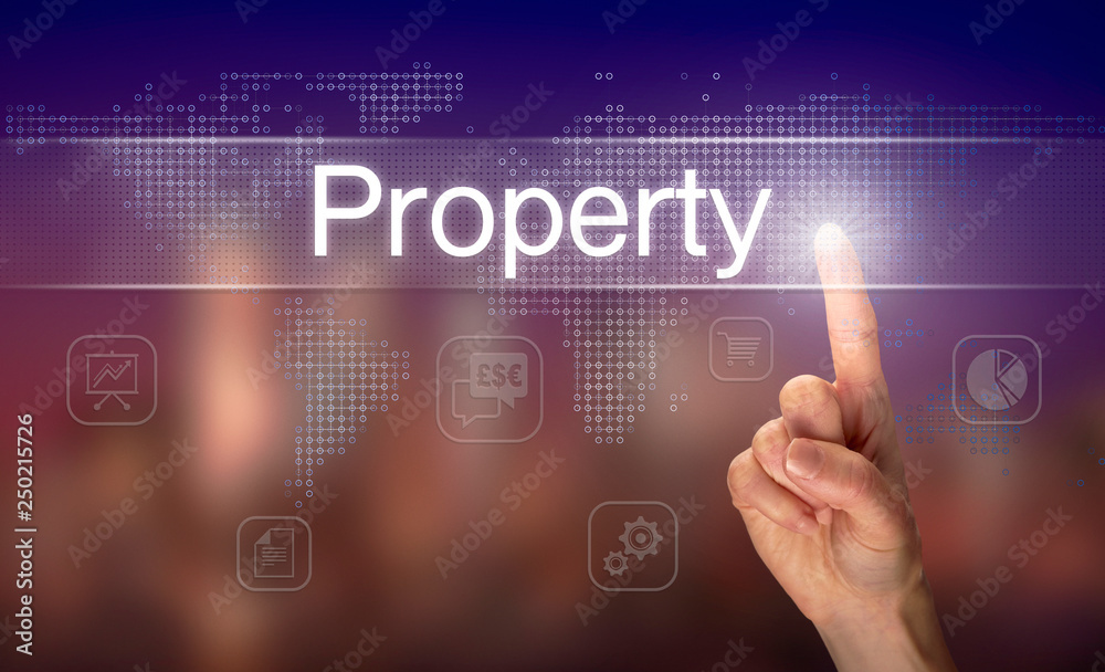 A hand selecting a Property business concept on a clear screen with a colorful blurred background.