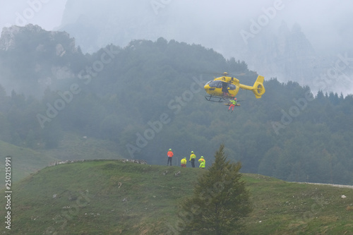 Helicopter emergency and rescue team in training day. Mountain, Italy. September 2018