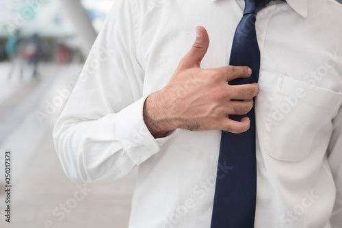sick Asian man with acid reflux or gerd; portrait of unhealthy, sick Asian Indian man with reflux, inflammation