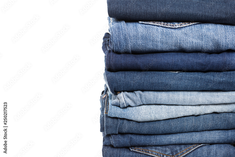 stack of various shades of blue jeans stack of various shades of blue jeans