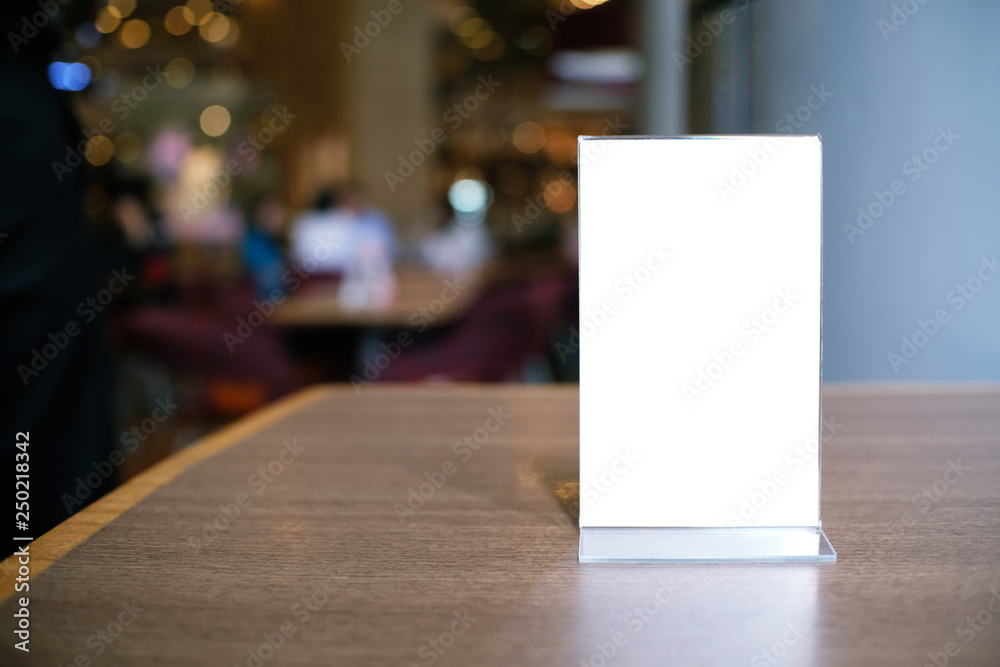 Menu frame standing on wood table in Bar restaurant cafe. space for text marketing promotion.
