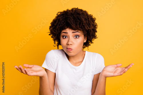 Close-up portrait of her she nice attractive puzzled ignorant wavy-haired girl showing gesture no information isolated on bright vivid shine yellow background