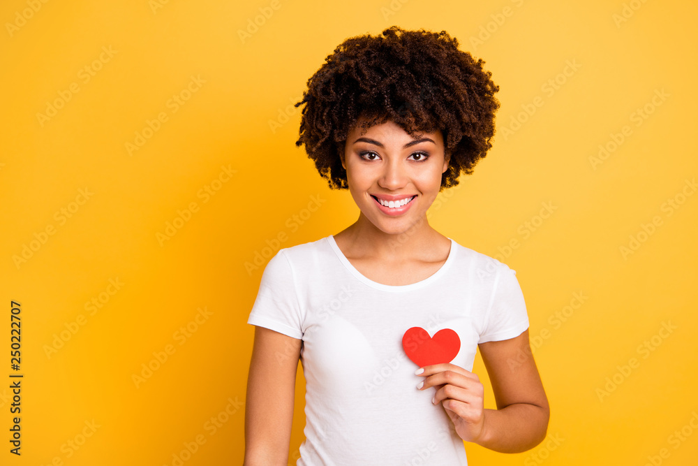 Close up photo beautiful amazing she her dark skin lady healthy heart safety message paper shape figure postcard lovely wear casual white t-shirt isolated yellow bright vibrant background Close up photo beautiful amazing she her dark skin lady healthy heart safety message paper shape figure postcard lovely wear casual white t-shirt isolated yellow bright vibrant background