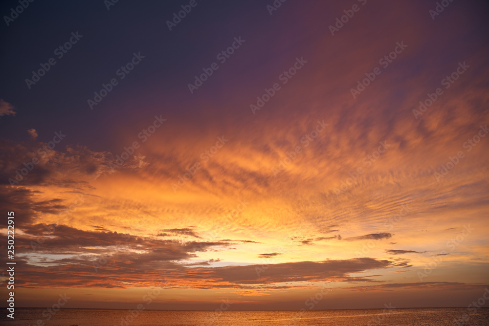 Beautiful sunset on the sea and sky with clouds.