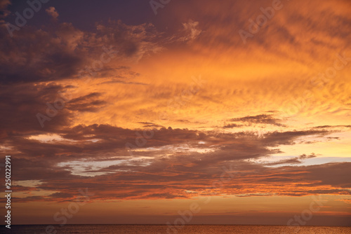 Beautiful sunset on the sea and sky with clouds. © smirs