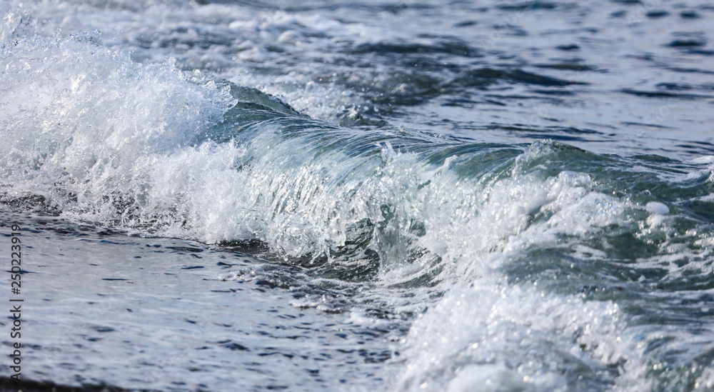 Waves on the seashore as an abstract background