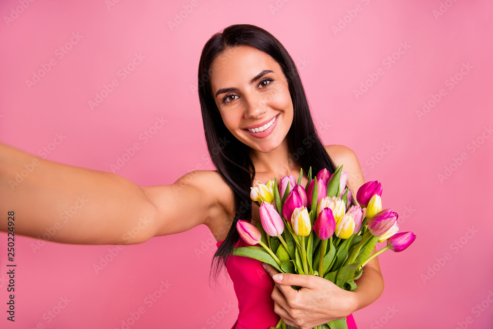 Self-portrait of her she nice cute cool adorable sweet attractive lovely fascinating charming cheerful brunette straight-haired lady holding in hands early natural flowers isolated on pink background Self-portrait of her she nice cute cool adorable sweet attractive lovely fascinating charming cheerful brunette straight-haired lady holding in hands early natural flowers isolated on pink background