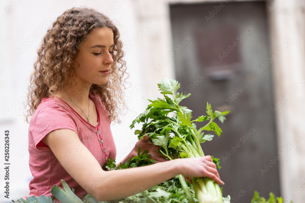 Young woman shopping for vegetables and fruit at the market Young woman shopping for vegetables and fruit at the market